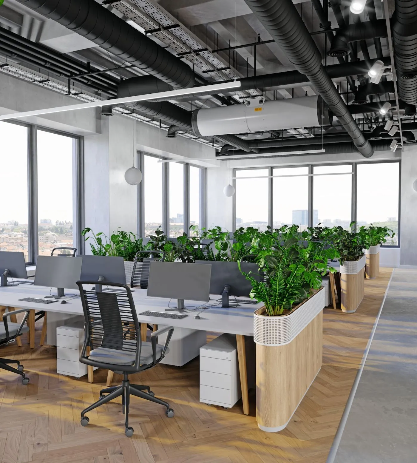 Oficina abierta con estaciones de trabajo y vegetación
